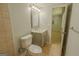 Neutral bathroom with gray vanity, ceramic tile flooring, and updated fixtures at 3781 Deercreek Dr, Powder Springs, GA 30127