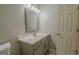 Modern bathroom featuring a stylish mirror, well-lit vanity, and neutral color palette at 3781 Deercreek Dr, Powder Springs, GA 30127