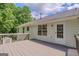 Wooden deck offers private outdoor space with views of surrounding trees and backyard at 3781 Deercreek Dr, Powder Springs, GA 30127