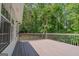 Wooden deck provides outdoor living space with railing and views of the surrounding trees at 3781 Deercreek Dr, Powder Springs, GA 30127