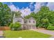 Beautiful two-story home featuring an attached two-car garage, complemented by a lush, green lawn at 3781 Deercreek Dr, Powder Springs, GA 30127