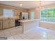Well-lit kitchen with stainless steel appliances, bar seating, modern fixtures, and granite countertops at 3781 Deercreek Dr, Powder Springs, GA 30127