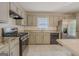Bright kitchen featuring stainless steel appliances, granite countertops, white subway tile, and bar seating at 3781 Deercreek Dr, Powder Springs, GA 30127