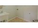 Practical laundry room with utility sink and tiled flooring at 3781 Deercreek Dr, Powder Springs, GA 30127