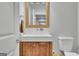 Stylish bathroom with a sleek vessel sink, wooden vanity, and modern fixtures at 4520 Odum Lake Trl, Cumming, GA 30040