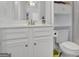 Clean bathroom with a white vanity, ample storage, and modern fixtures at 4520 Odum Lake Trl, Cumming, GA 30040