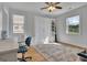 Inviting bedroom with a Murphy bed and desk with bright natural light at 4520 Odum Lake Trl, Cumming, GA 30040