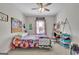 Bright bedroom with study area, carpeted floors, and fun decor at 4520 Odum Lake Trl, Cumming, GA 30040