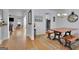 Bright and airy dining room with hardwood floors, decorative rug, and large wood table with bench seating at 4520 Odum Lake Trl, Cumming, GA 30040
