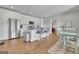Modern kitchen with white cabinets, stainless steel appliances, and an island with bar seating at 4520 Odum Lake Trl, Cumming, GA 30040
