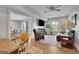 Spacious living room with hardwood floors, a TV, comfortable seating, and ample natural light at 4520 Odum Lake Trl, Cumming, GA 30040
