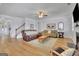 Cozy living room boasts hardwood floors, neutral tones, and ample natural light at 4520 Odum Lake Trl, Cumming, GA 30040