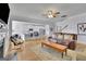 Open concept living space featuring hardwood floors, fireplace, ample seating, and seamless flow to the kitchen at 4520 Odum Lake Trl, Cumming, GA 30040