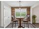 Charming breakfast nook featuring bar-height seating and a window with natural light at 142 Holly Mill Village Dr, Canton, GA 30114