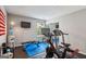 Bright exercise room featuring gym equipment, mounted TV, and geometric ceiling at 142 Holly Mill Village Dr, Canton, GA 30114