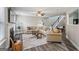 Spacious living room with hardwood floors, fireplace, neutral paint, and a ceiling fan enhances the ambiance at 142 Holly Mill Village Dr, Canton, GA 30114