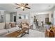 Comfortable living room featuring an open layout, ceiling fan, and lots of natural light at 142 Holly Mill Village Dr, Canton, GA 30114