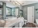 Spacious main bathroom showcasing double sinks, a soaking tub, and modern fixtures at 142 Holly Mill Village Dr, Canton, GA 30114