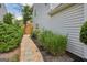 Stone-lined walkway leading to fenced backyard at 142 Holly Mill Village Dr, Canton, GA 30114
