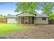 Large backyard featuring a screened porch at 1694 Pheasant Dr, Atlanta, GA 30238