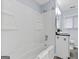 Bright bathroom with white tiled shower and vanity at 1694 Pheasant Dr, Atlanta, GA 30238