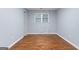 This bedroom features a hardwood floor and natural light at 1694 Pheasant Dr, Atlanta, GA 30238