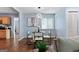 Cozy dining area with modern lighting, stylish seating, and hardwood floors, perfect for intimate gatherings at 1694 Pheasant Dr, Atlanta, GA 30238
