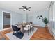 Elegant dining room with modern decor, a stylish rug, and wood flooring, creating a perfect space for Gathering meals at 1694 Pheasant Dr, Atlanta, GA 30238