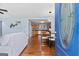 Inviting entryway showcasing an open floor plan with hardwood floors, a glimpse of the kitchen, and a stylish dining area at 1694 Pheasant Dr, Atlanta, GA 30238