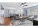 Open-concept living room seamlessly connected to the dining area, featuring hardwood floors and tasteful furnishings at 1694 Pheasant Dr, Atlanta, GA 30238