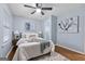 Comfortable bedroom with a ceiling fan and modern wall art at 1694 Pheasant Dr, Atlanta, GA 30238