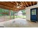 Covered screened porch with ceiling fan and view of backyard at 1694 Pheasant Dr, Atlanta, GA 30238