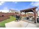Inviting backyard featuring a patio, pergola, seating area, and grill at 3735 Westhaven Dr, Cumming, GA 30040