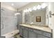 Bright bathroom featuring a glass shower and double vanity with granite counters at 3735 Westhaven Dr, Cumming, GA 30040