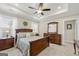 Spacious bedroom with tray ceiling, large bed, and plenty of natural light at 3735 Westhaven Dr, Cumming, GA 30040