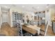 Inviting dining area flows into a kitchen with gray cabinets and a large island, perfect for gatherings at 3735 Westhaven Dr, Cumming, GA 30040
