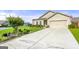 Inviting home featuring a manicured lawn and a lengthy concrete driveway at 3735 Westhaven Dr, Cumming, GA 30040