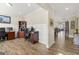 Open home office with wainscotting, hardwood floors and a view into the living room at 3735 Westhaven Dr, Cumming, GA 30040