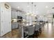 Open concept kitchen with gray cabinetry, a large island, and barstool seating at 3735 Westhaven Dr, Cumming, GA 30040