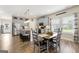 Open concept kitchen and dining area with stainless steel appliances and gray cabinets at 3735 Westhaven Dr, Cumming, GA 30040