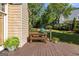 Inviting back deck with a green egg grill and a lush backyard at 4729 Woodland Brook Se Ct, Atlanta, GA 30339