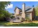 Beautiful backyard with a spacious deck, patio seating, and mature trees at 4729 Woodland Brook Se Ct, Atlanta, GA 30339