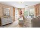 A charming Bedroom with floral wallpaper, white furniture, and a bright, airy feel at 4729 Woodland Brook Se Ct, Atlanta, GA 30339