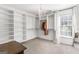 A well-organized walk-in closet with built-in shelving and a chandelier at 4729 Woodland Brook Se Ct, Atlanta, GA 30339