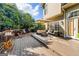 Spacious outdoor deck featuring comfortable seating, a dining area, and lush greenery at 4729 Woodland Brook Se Ct, Atlanta, GA 30339