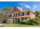 Beautiful two-story brick home with lush landscaping, front lawn and a two-car garage at 4729 Woodland Brook Se Ct, Atlanta, GA 30339
