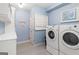 Well-organized laundry room features a washer, dryer, and plenty of storage space at 4729 Woodland Brook Se Ct, Atlanta, GA 30339