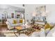 Bright living room featuring hardwood floors, contemporary decor, and a view into the kitchen at 4729 Woodland Brook Se Ct, Atlanta, GA 30339