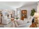 Cozy living area showcasing armchairs, a decorative table, and open access to the dining area at 4729 Woodland Brook Se Ct, Atlanta, GA 30339