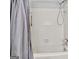 Clean bathroom featuring a tub and shower with white tile surround and neutral gray shower curtain at 830 Bonnie Glen Se Dr, Marietta, GA 30067